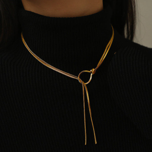 women wearing gold necklace