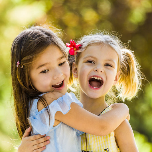 two girls hugging together