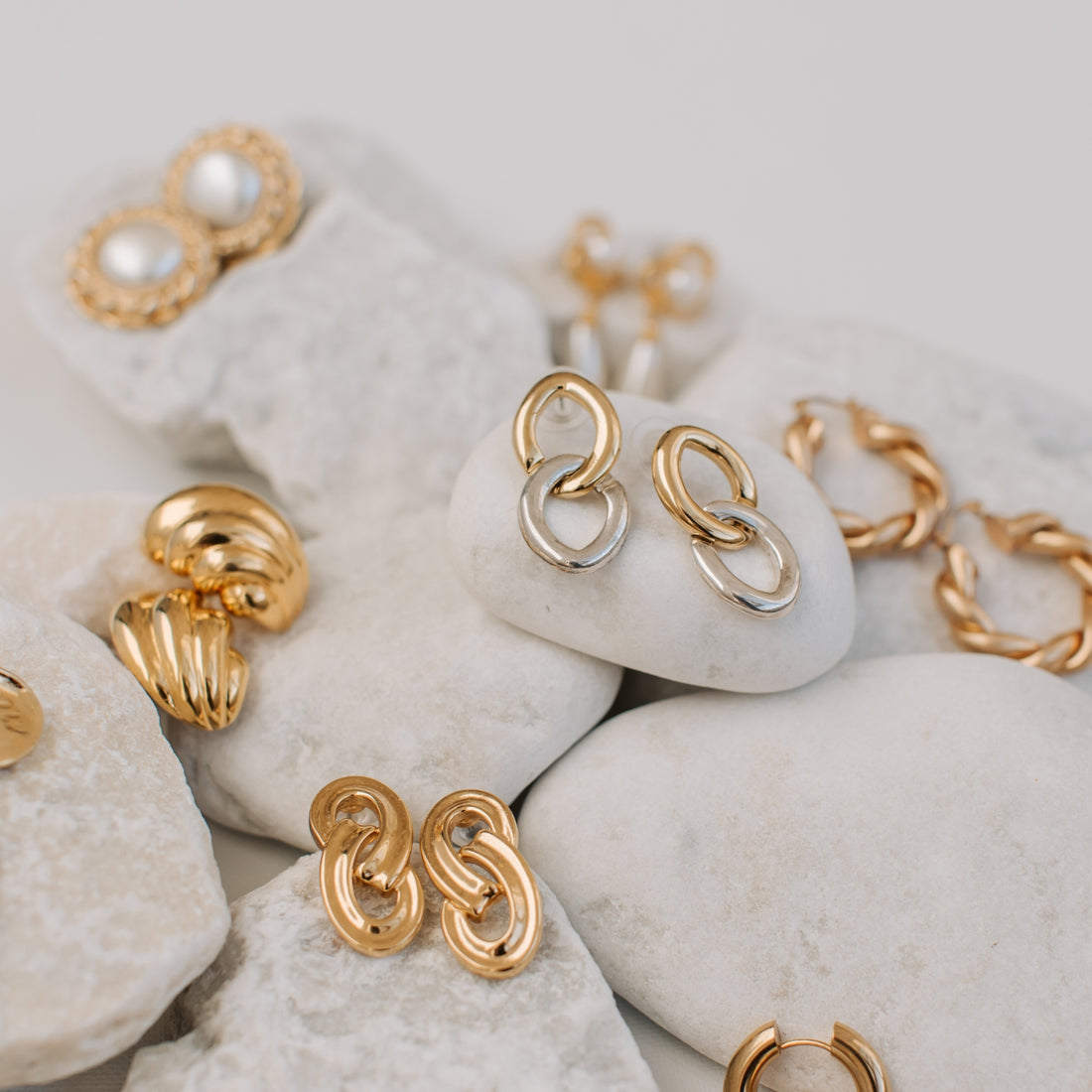 Gold earrings on rock