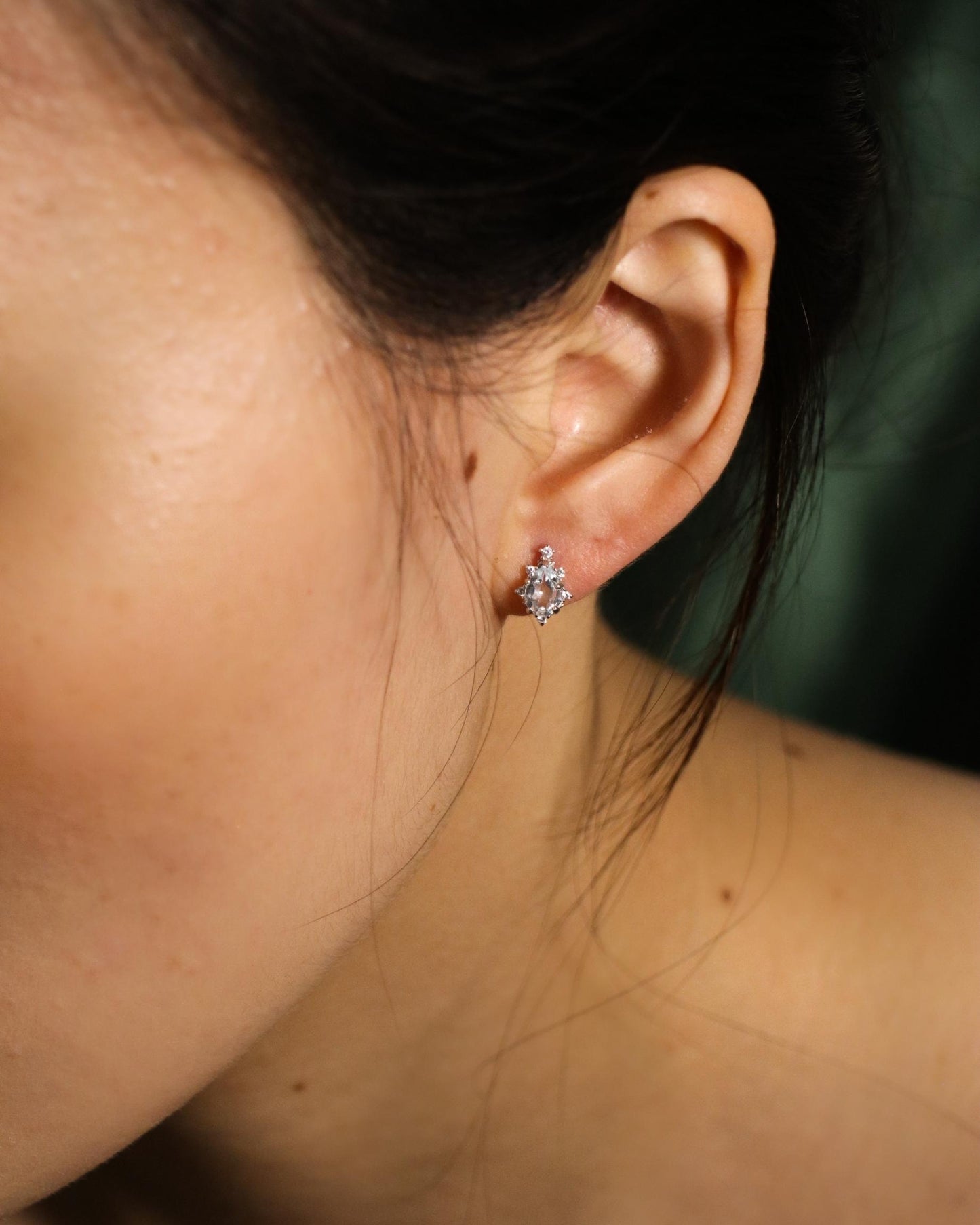 model wearing colourful crystal and zirconia stud earrings