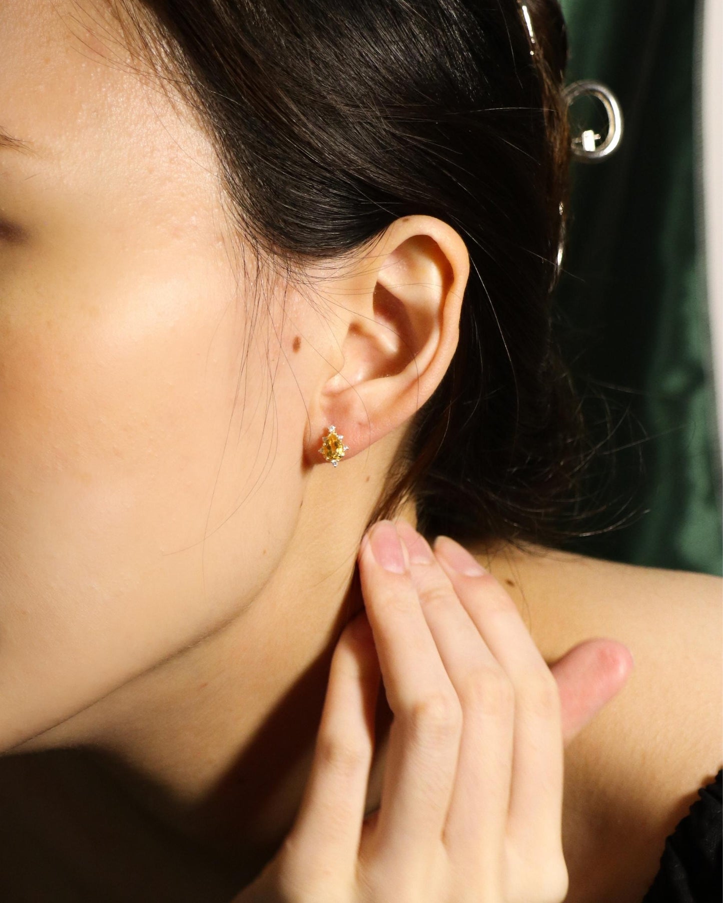 model wearing colourful crystal and zirconia stud earrings