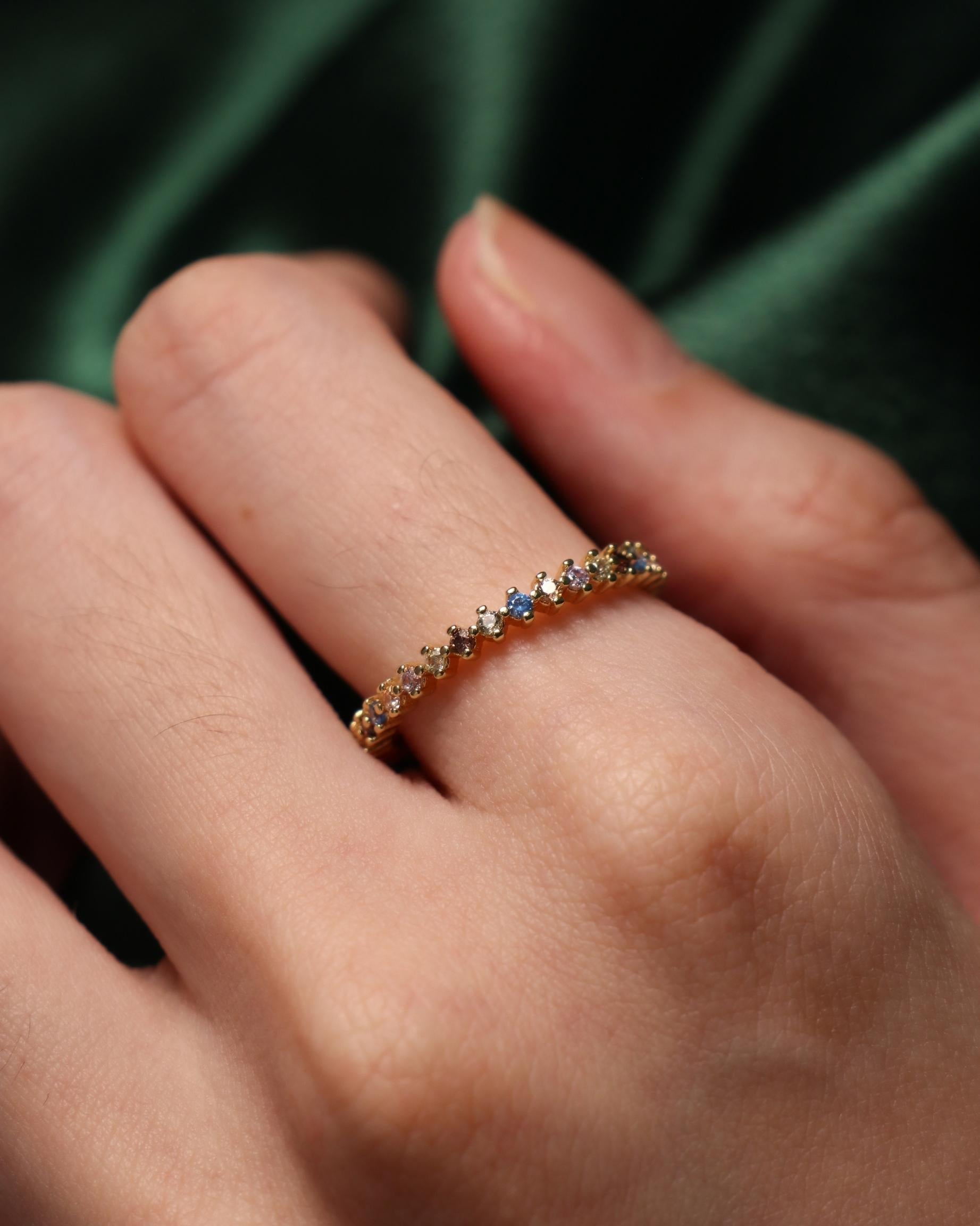model wearing colourful zirconia ring
