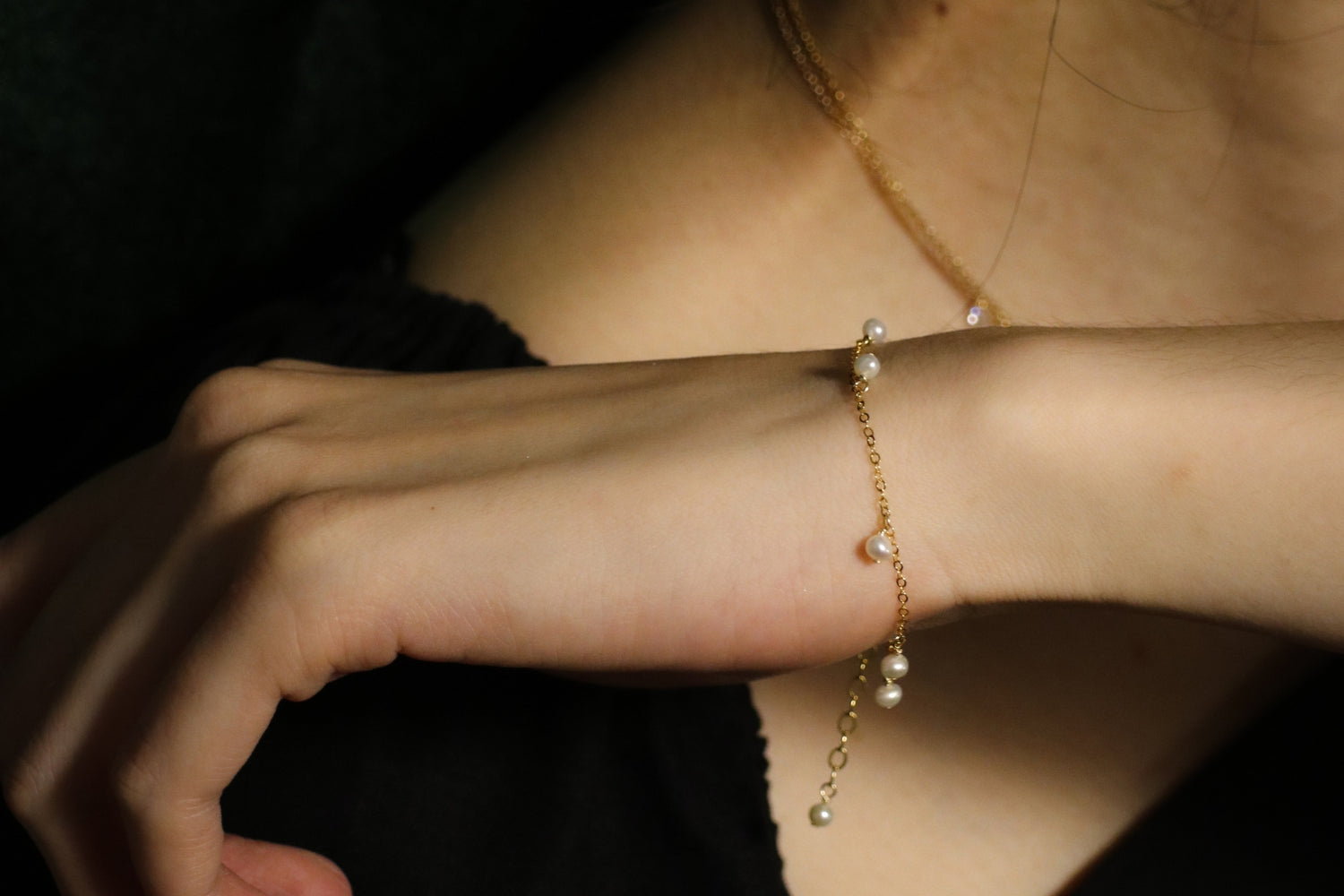 woman wearing gold filled bracelets