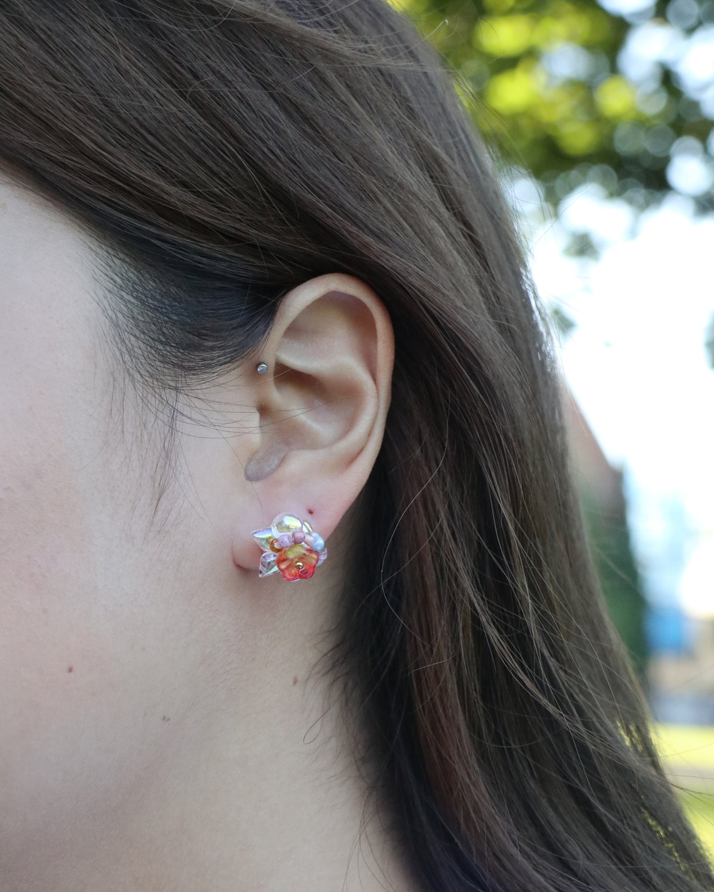 bloom flower stud earrings worn on ear