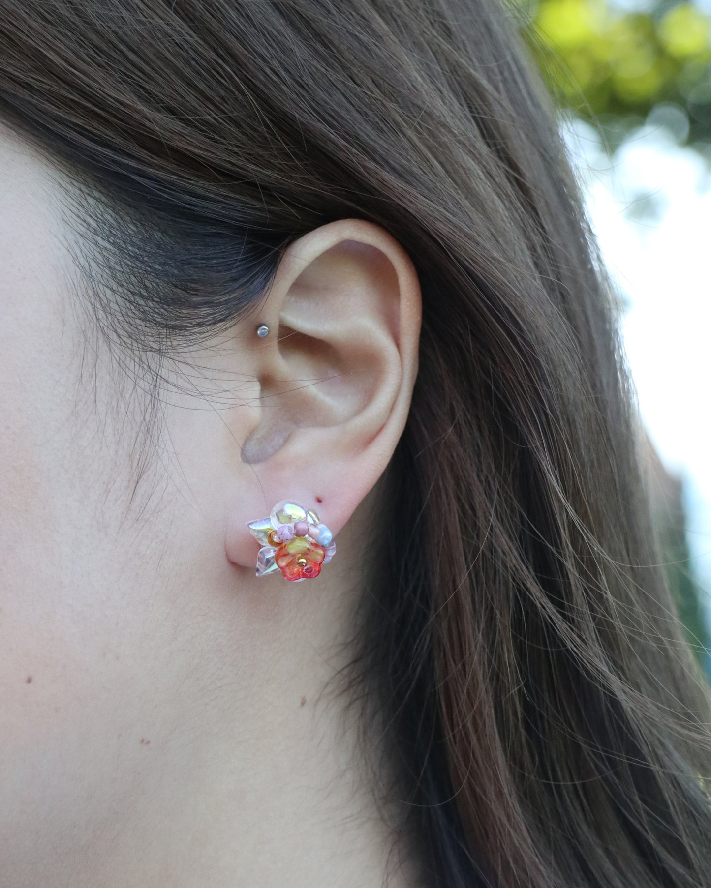 bloom flower stud earrings worn on ear