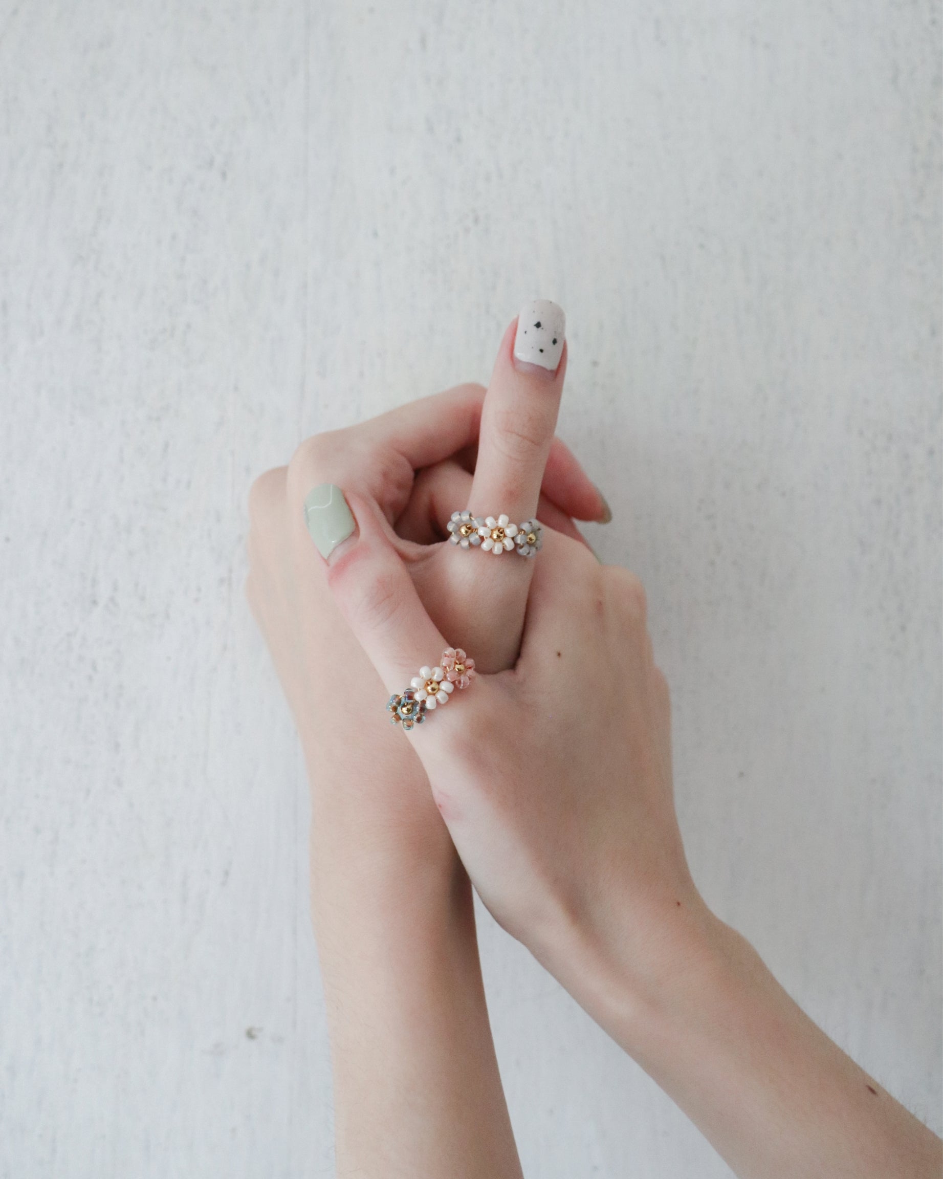 model wearing floral beaded ring