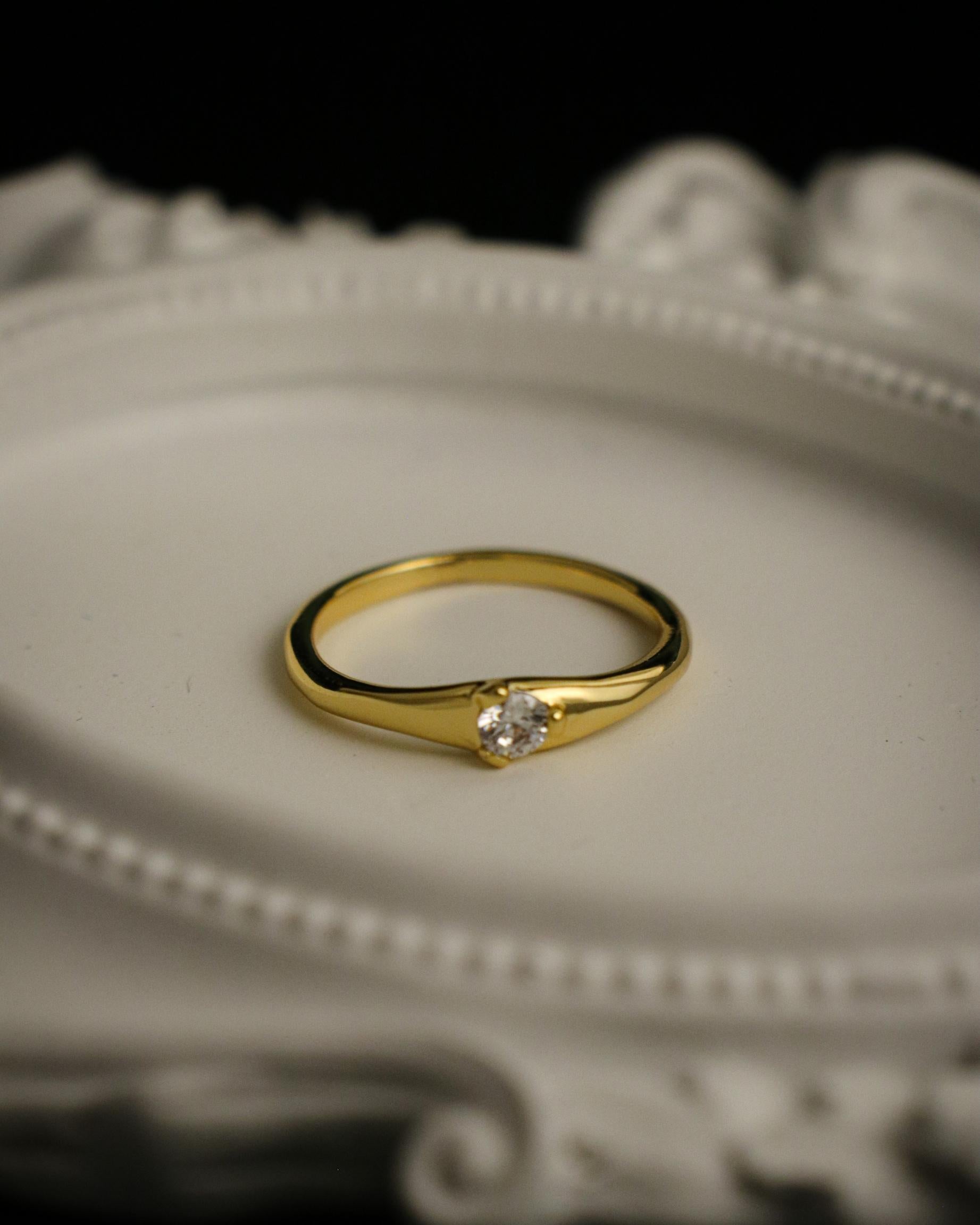 close up of white gemstone ring