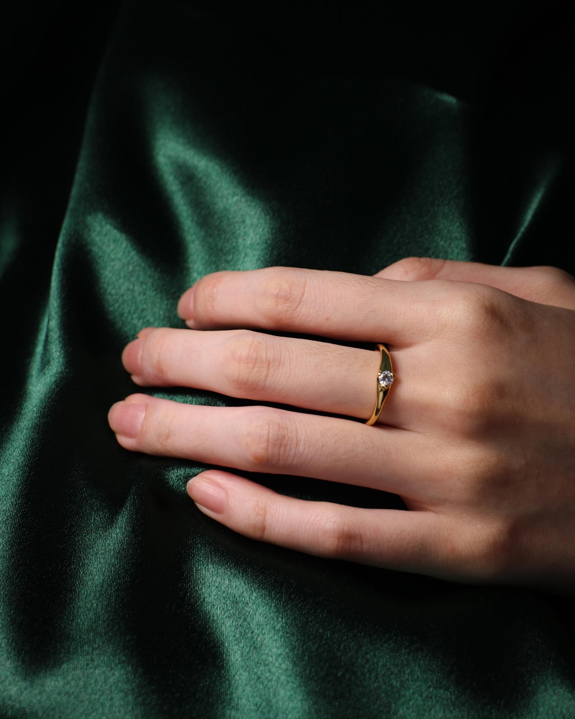 model wearing white gemstone ring