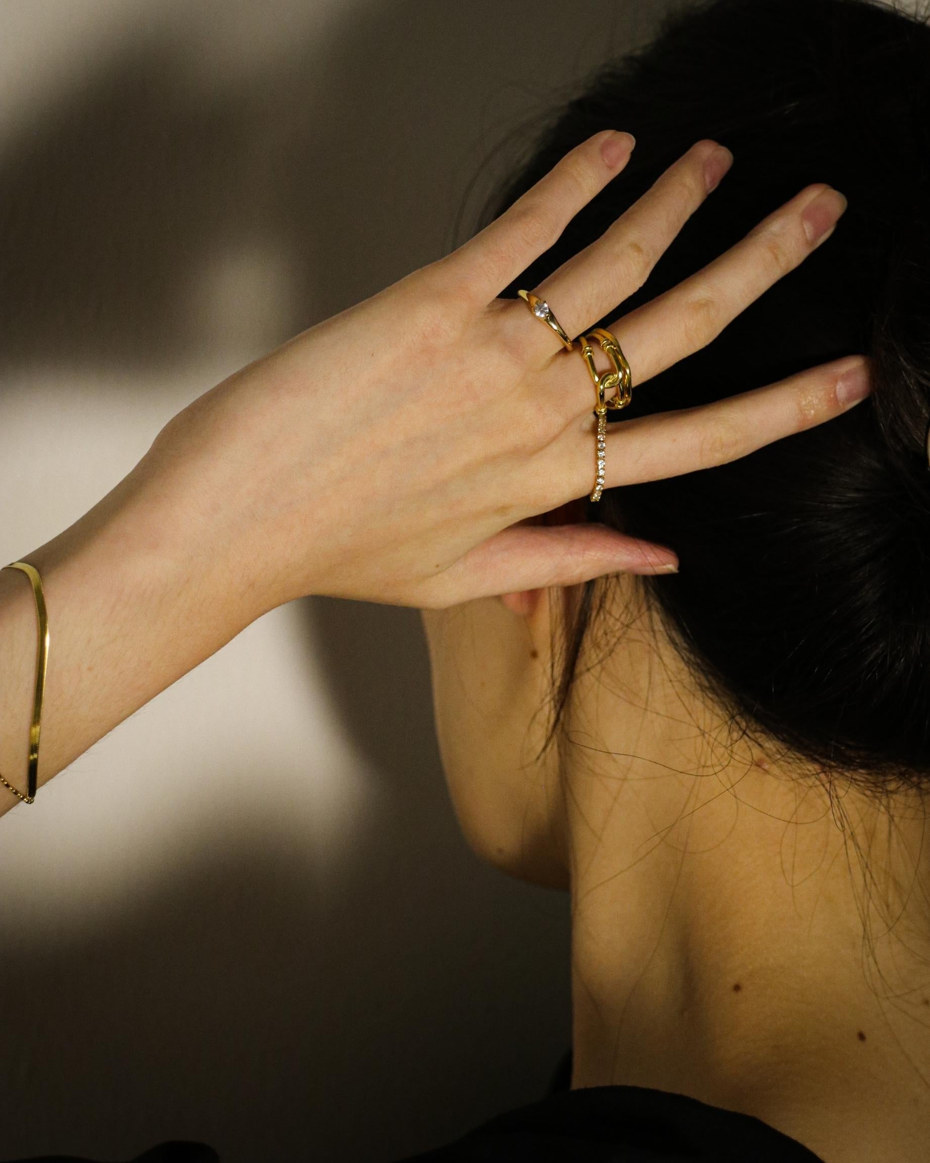woman wearing gemstone ring