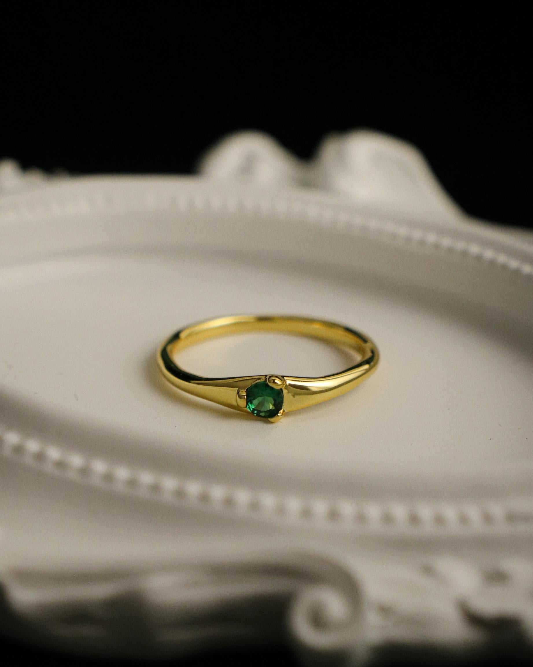 green gemstone ring