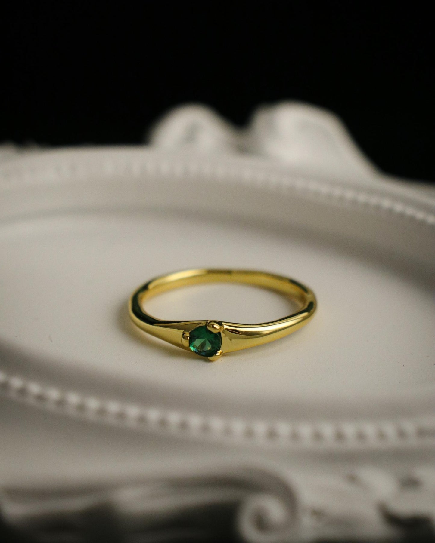 close up of green gemstone ring